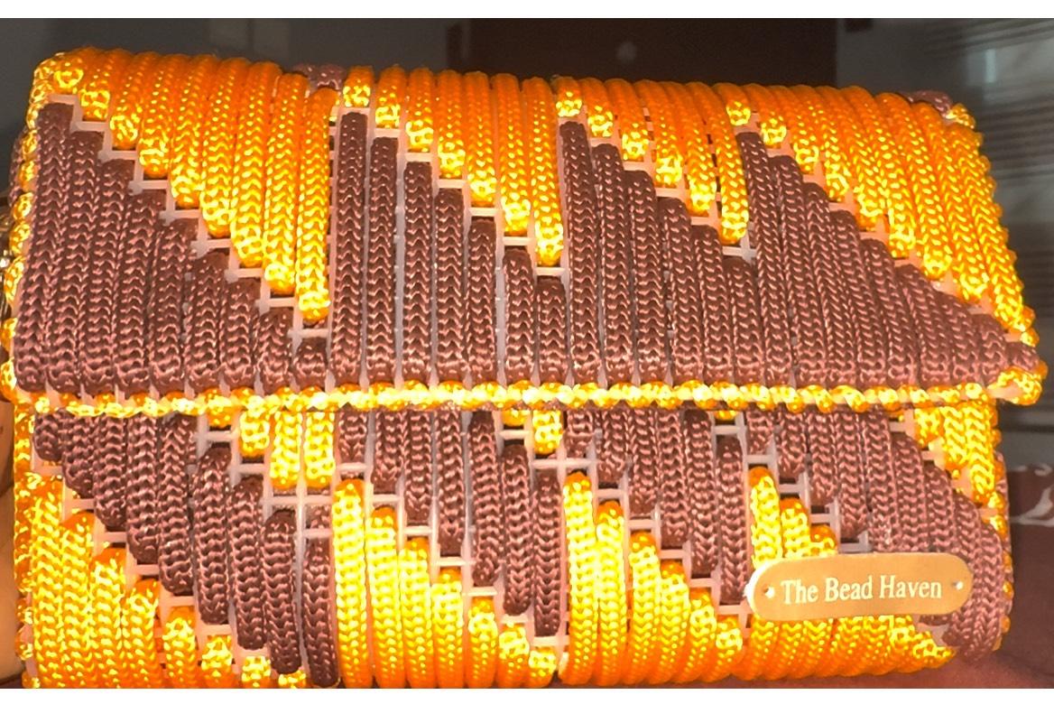 Handwoven orange and brown plastic canvas clutch/crossbody bag