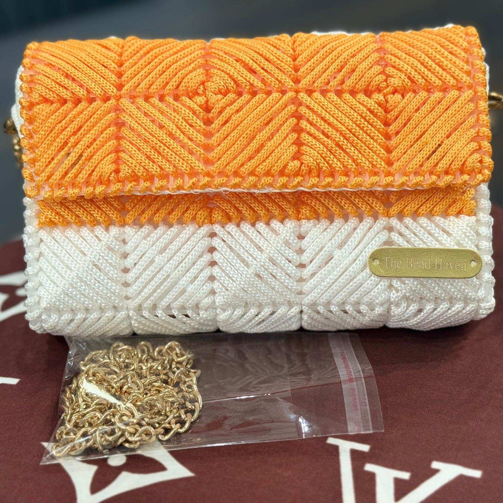 Handwoven orange and white plastic canvas clutch/ crossbody bag